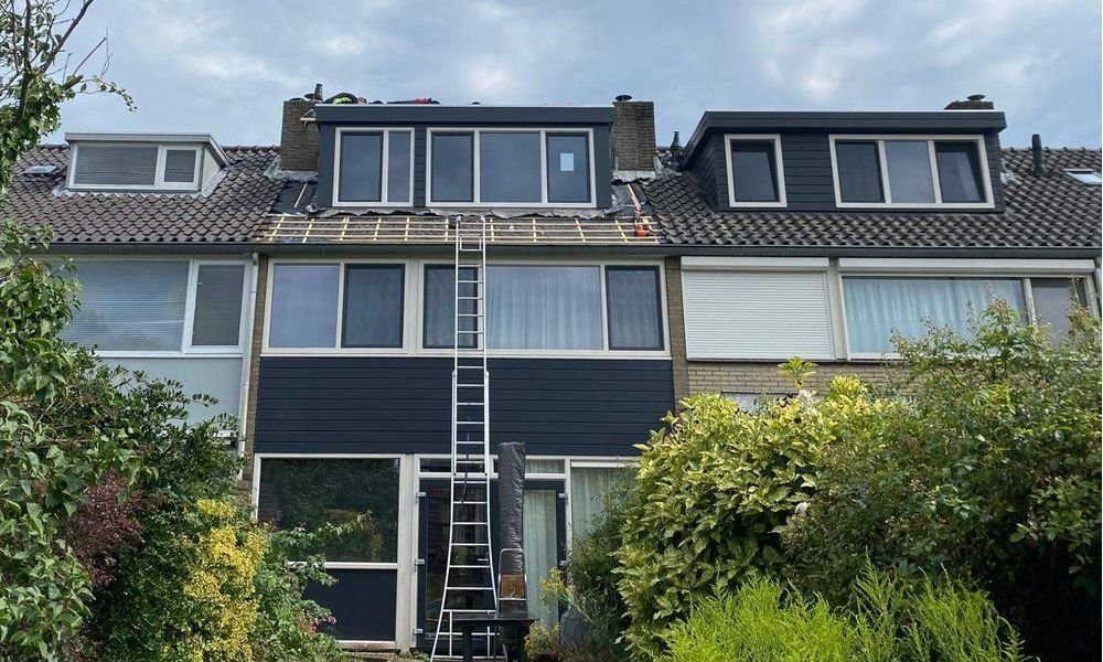 Wat kost een plat dak herstellen in Maasland?